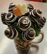 Chocolate covered strawberries in a mug