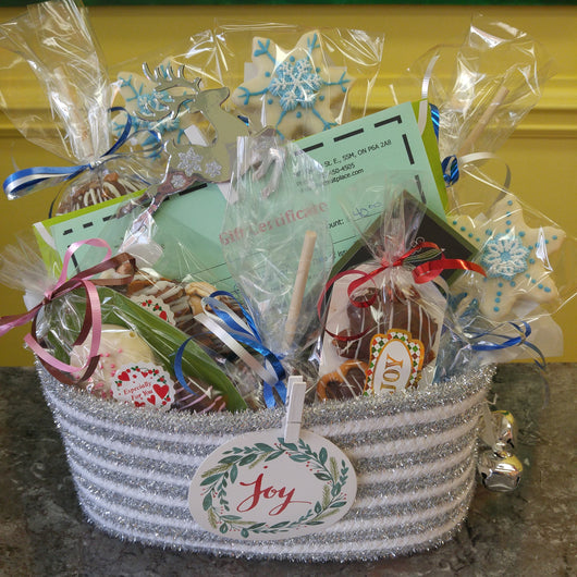 A basket full of fun. Our handmade treats, a gift certificate, and chocolate covered strawberries all wrapped up for giving.  Not Just For Christmas.  Order for Birthday, Thank You, Thinking of You and more!  Chocolate is the perfect gift - anytime!